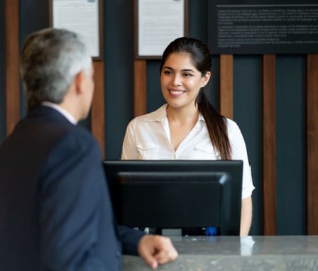 Woman at computer helping someone